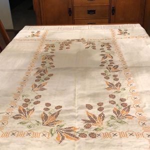 Retro cross stitched linen embroidered vintage tablecloth. Acorns and leaves
